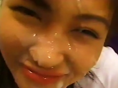 A Young Asian Woman Is Receiving Oral Sex From Multiple Partners While Being Filmed.